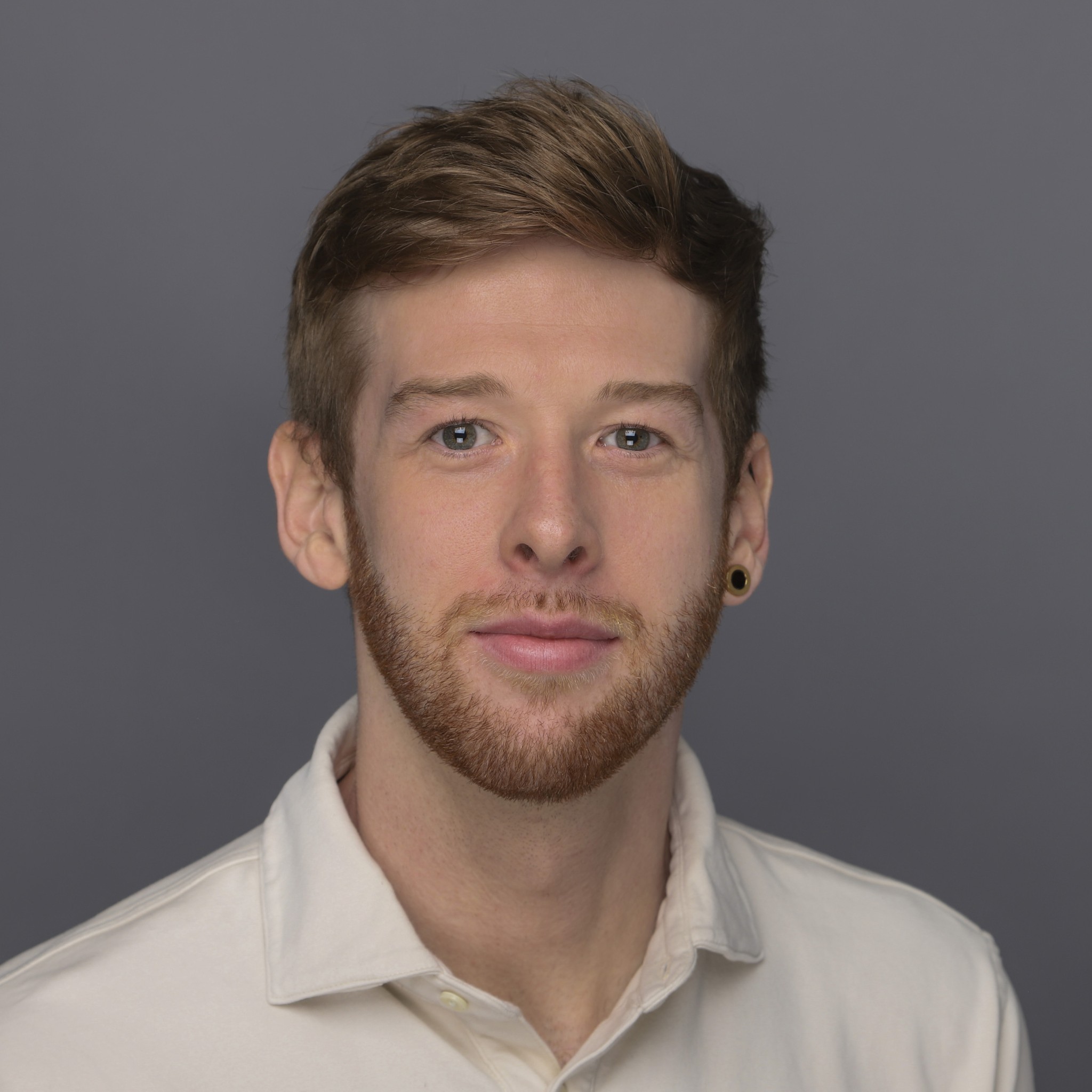 A portrait of a young man smiling
